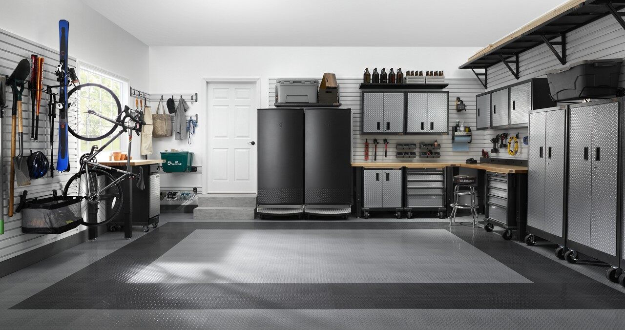 Garage organized with Gladiator Appliances, Workbench, and Cabinets